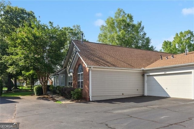 3707 Vineyards Lake Cir NW Unit 22, Kennesaw, GA 30144 - garage featuring driveway
