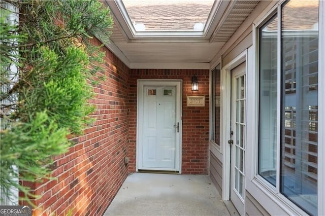 3707 Vineyards Lake Cir NW Unit 22, Kennesaw, GA 30144 - doorway to property featuring brick siding and a shingled roof