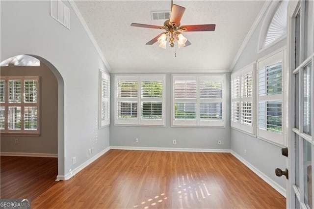 3707 Vineyards Lake Cir NW Unit 22, Kennesaw, GA 30144 - unfurnished sunroom featuring vaulted ceiling, plenty of natural light, and arched walkways