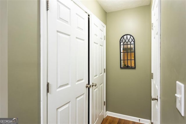 1643 Trey Ln, Winder, GA 30680 - hallway featuring dark wood-type flooring and a textured ceiling