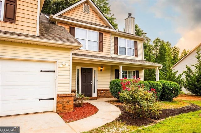 1643 Trey Ln, Winder, GA 30680 - traditional home with a porch, roof with shingles, a chimney, and brick siding