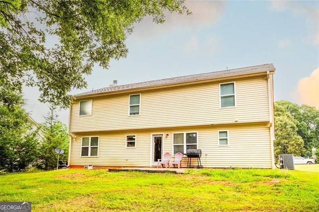 1643 Trey Ln, Winder, GA 30680 - back of property with a lawn and a patio