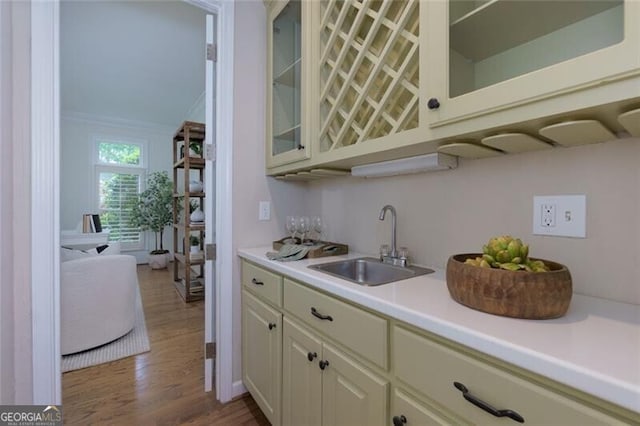 360 Hannaford Dr, Roswell, GA 30075 - kitchen with light countertops, wood finished floors, glass insert cabinets, and white cabinetry