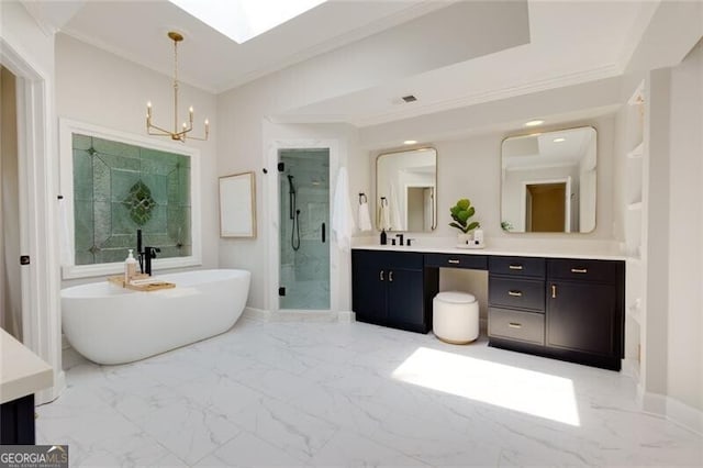 360 Hannaford Dr, Roswell, GA 30075 - bathroom with double vanity, marble finish floors, a freestanding tub, a chandelier, and crown molding