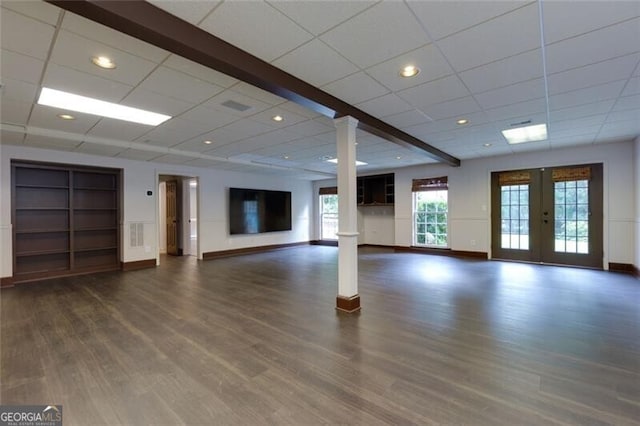 360 Hannaford Dr, Roswell, GA 30075 - unfurnished living room with french doors, dark wood finished floors, a drop ceiling, decorative columns, and built in shelves