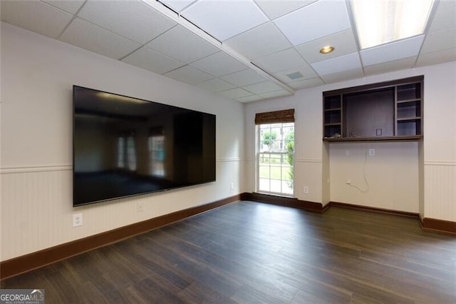 360 Hannaford Dr, Roswell, GA 30075 - empty room with dark wood-style floors, a drop ceiling, and a wainscoted wall