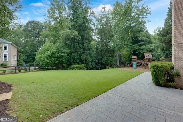 360 Hannaford Dr, Roswell, GA 30075 - view of yard featuring a playground and a patio area