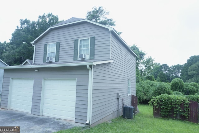 5761 Antelope Trl, Atlanta, GA 30349 - view of home's exterior with a lawn, cooling unit, and a garage