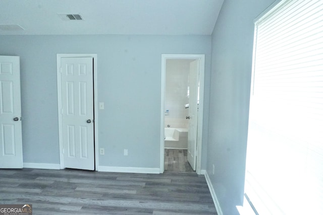 5761 Antelope Trl, Atlanta, GA 30349 - unfurnished bedroom with wood finished floors and ensuite bath