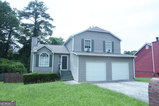 5761 Antelope Trl, Atlanta, GA 30349 - view of front of house featuring an attached garage, concrete driveway, a chimney, and a front yard