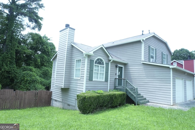 5761 Antelope Trl, Atlanta, GA 30349 - view of front facade featuring a chimney and crawl space