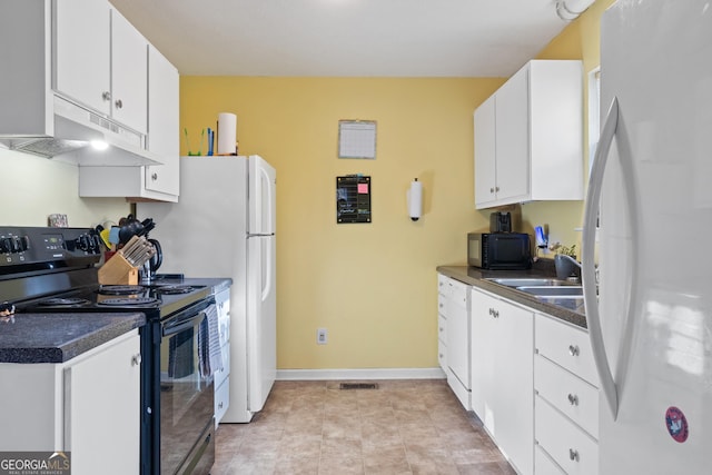 110 Clearview St, Clarkesville, GA 30523 - kitchen with black appliances, under cabinet range hood, dark countertops, and white cabinetry