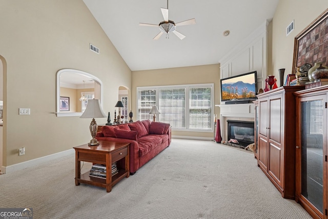 25 Hampreston Ct, Alpharetta, GA 30022 - living area with a ceiling fan, high vaulted ceiling, carpet floors, a fireplace, and arched walkways