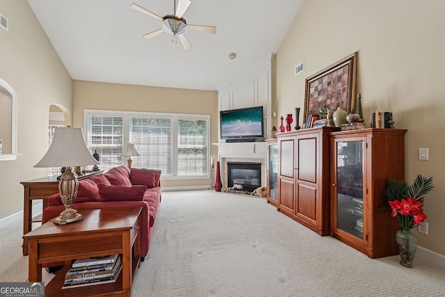 25 Hampreston Ct, Alpharetta, GA 30022 - living room with carpet flooring, ceiling fan, a glass covered fireplace, and vaulted ceiling