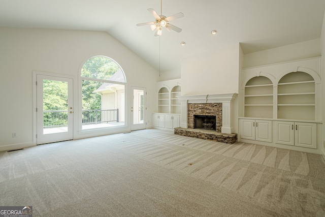 2814 Tanner Lake Trl NW, Marietta, GA 30064 - unfurnished living room featuring high vaulted ceiling, ceiling fan, built in shelves, carpet, and a fireplace