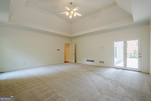2814 Tanner Lake Trl NW, Marietta, GA 30064 - spare room with a raised ceiling, crown molding, light colored carpet, and a ceiling fan