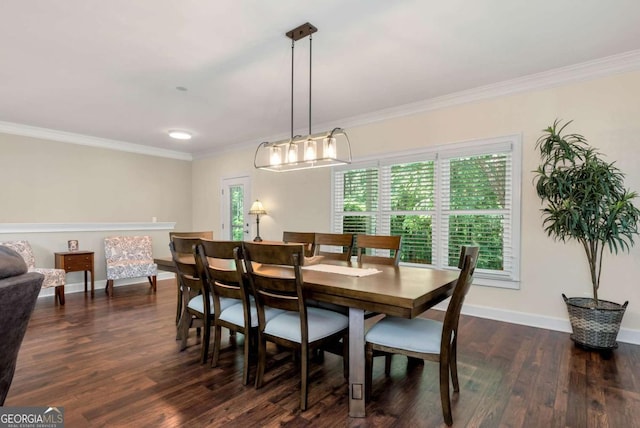 4882 Rabbit Farm Rd, Loganville, GA 30052 - dining room featuring dark wood finished floors and crown molding