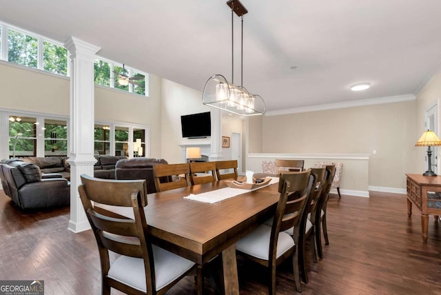 4882 Rabbit Farm Rd, Loganville, GA 30052 - dining room with ornate columns, dark wood-style floors, and ornamental molding