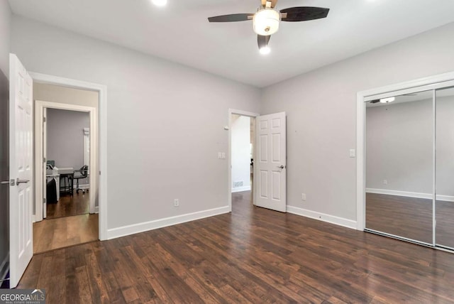 4882 Rabbit Farm Rd, Loganville, GA 30052 - unfurnished bedroom with wood finished floors, a closet, ceiling fan, and a desk