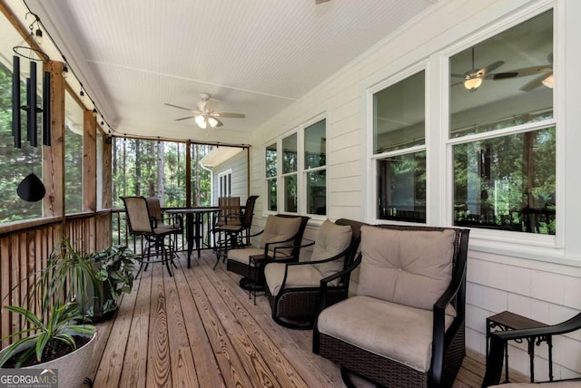 4882 Rabbit Farm Rd, Loganville, GA 30052 - sunroom with ceiling fan and outdoor dining space