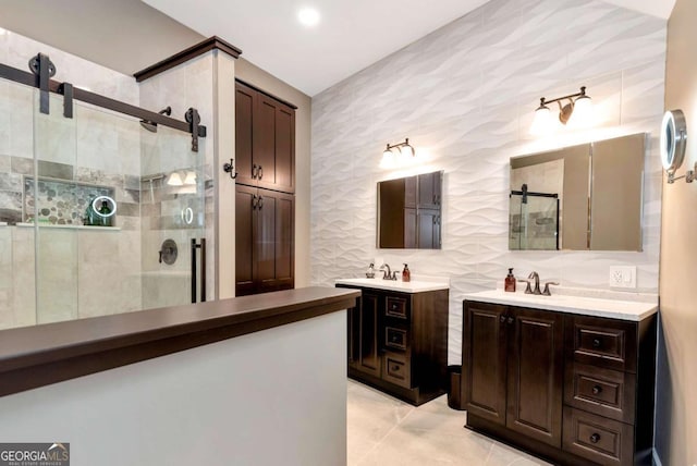 4882 Rabbit Farm Rd, Loganville, GA 30052 - bathroom featuring a shower stall, two vanities, and wallpapered walls
