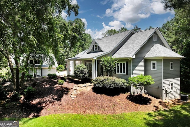 4882 Rabbit Farm Rd, Loganville, GA 30052 - view of front facade with a chimney and roof with shingles