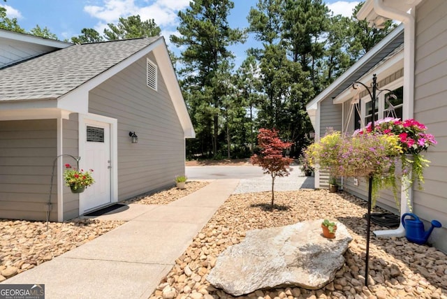 4882 Rabbit Farm Rd, Loganville, GA 30052 - view of side of home with a shingled roof and an outdoor structure