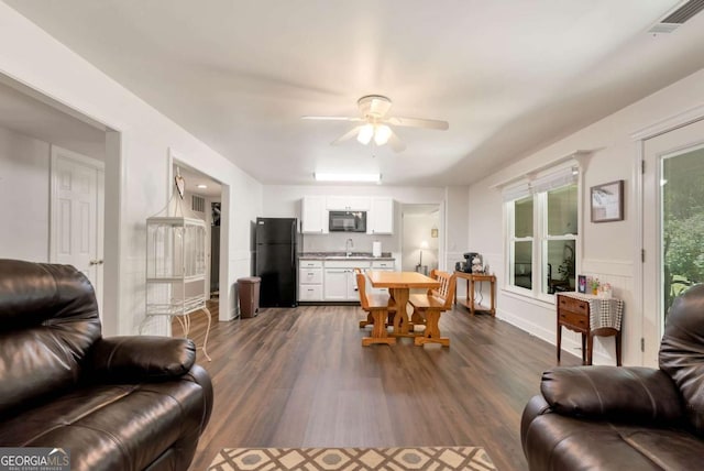 4882 Rabbit Farm Rd, Loganville, GA 30052 - living area with dark wood finished floors and a ceiling fan
