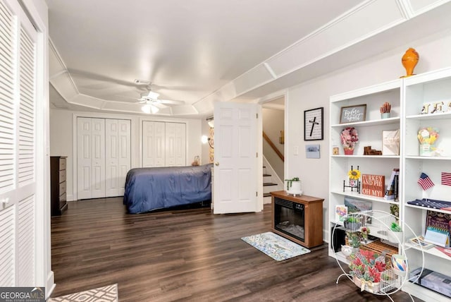 4882 Rabbit Farm Rd, Loganville, GA 30052 - bedroom featuring dark wood-style flooring, multiple closets, and ceiling fan