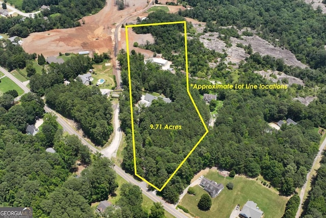 4882 Rabbit Farm Rd, Loganville, GA 30052 - aerial view of property and surrounding area with a heavily wooded area and property boundaries highlighted