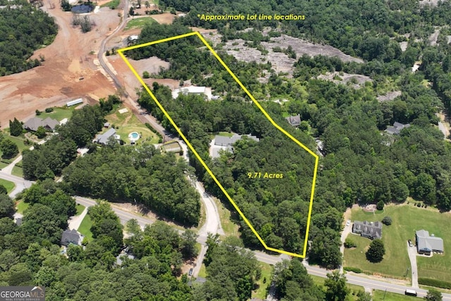4882 Rabbit Farm Rd, Loganville, GA 30052 - aerial overview of property's location featuring property parcel outlined and a forest