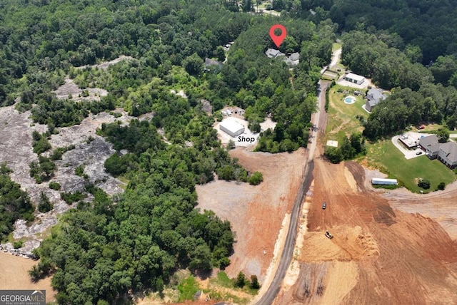 4882 Rabbit Farm Rd, Loganville, GA 30052 - aerial view of property's location featuring a heavily wooded area