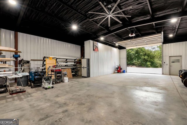 4882 Rabbit Farm Rd, Loganville, GA 30052 - garage with freestanding refrigerator and a workshop area