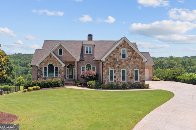 387 Gold Bullion Dr E, Dawsonville, GA 30534 - view of front of house with stone siding, a chimney, and concrete driveway