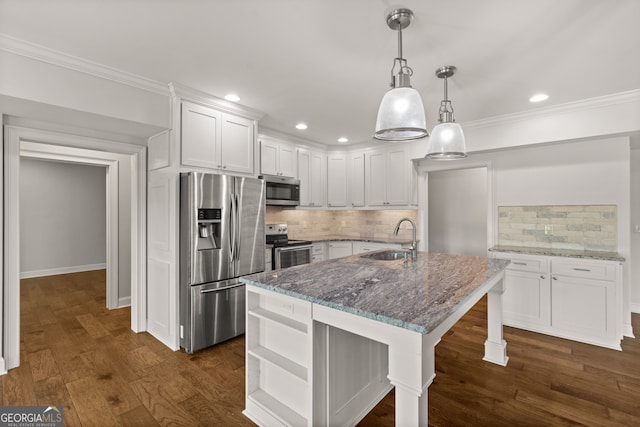 387 Gold Bullion Dr E, Dawsonville, GA 30534 - kitchen featuring stainless steel appliances, dark stone countertops, white cabinetry, tasteful backsplash, and recessed lighting