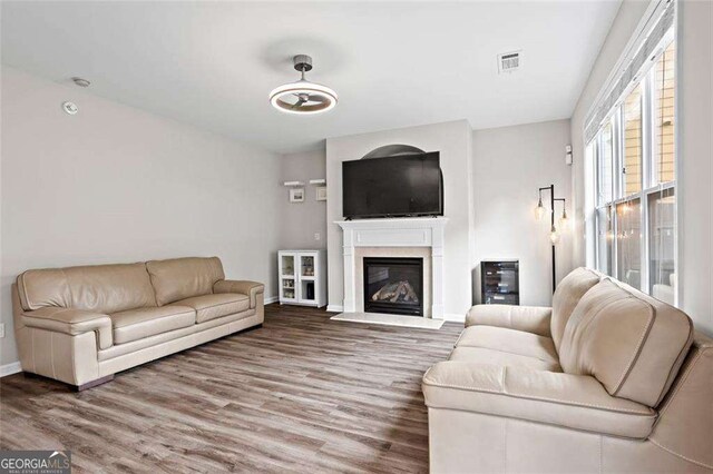 1786 Jameson Cir, Lawrenceville, GA 30043 - living area with wood finished floors and a glass covered fireplace