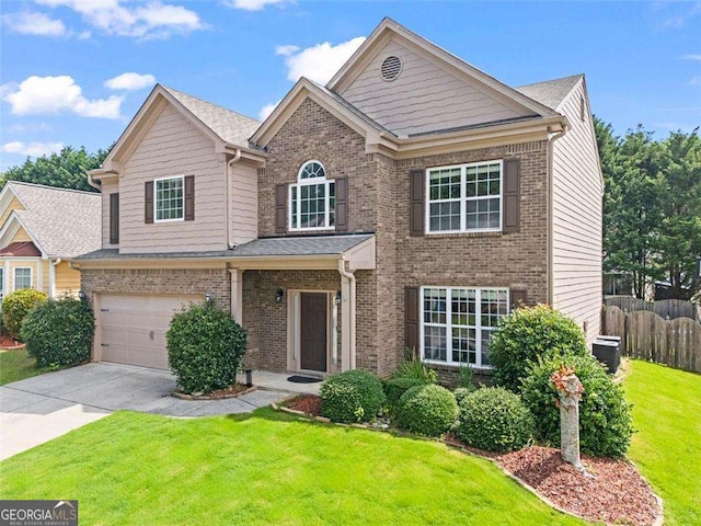 1786 Jameson Cir, Lawrenceville, GA 30043 - view of front of home with brick siding, concrete driveway, and a garage