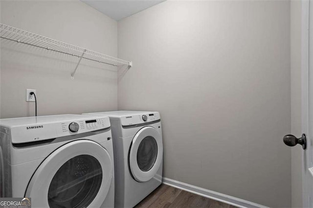 1786 Jameson Cir, Lawrenceville, GA 30043 - laundry area with washing machine and clothes dryer and dark wood-style flooring
