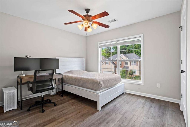 1786 Jameson Cir, Lawrenceville, GA 30043 - bedroom with wood finished floors, an office area, and ceiling fan