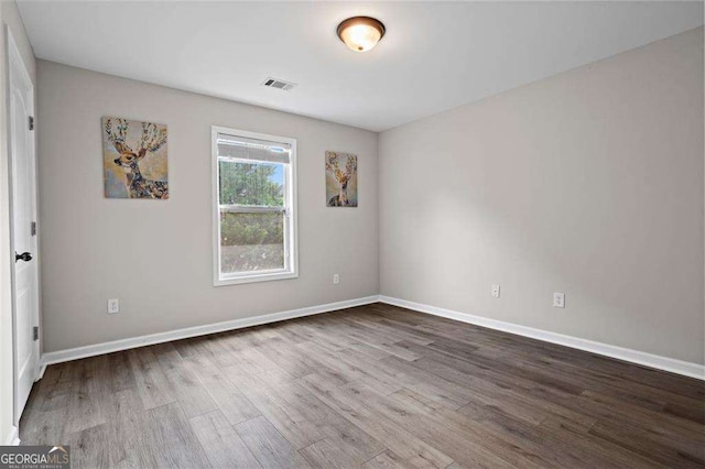 1786 Jameson Cir, Lawrenceville, GA 30043 - unfurnished room featuring wood finished floors and baseboards