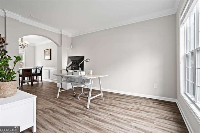 1786 Jameson Cir, Lawrenceville, GA 30043 - office space featuring arched walkways, crown molding, wood finished floors, and a chandelier