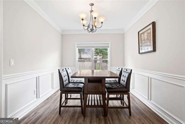1786 Jameson Cir, Lawrenceville, GA 30043 - dining room featuring a chandelier, dark wood-style floors, a decorative wall, ornamental molding, and a wainscoted wall