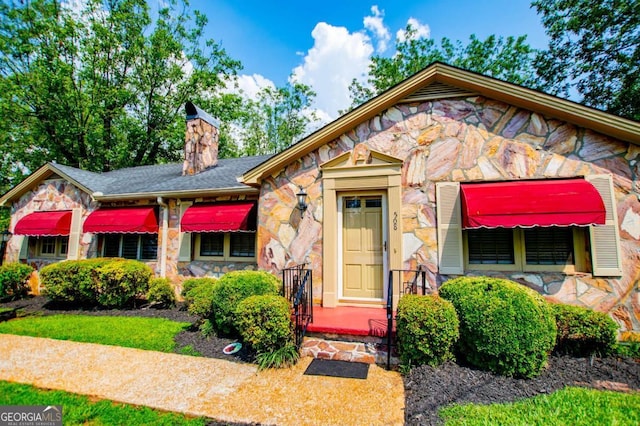 508 College St, Bowdon, GA 30108 - view of front of property with stone siding and a chimney