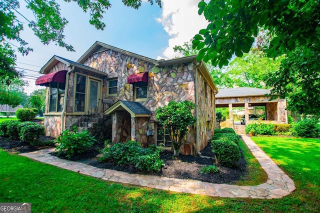 508 College St, Bowdon, GA 30108 - view of front of home with stone siding and a front lawn