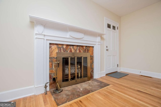 508 College St, Bowdon, GA 30108 - detailed view of a tiled fireplace and wood finished floors