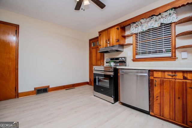 508 College St, Bowdon, GA 30108 - kitchen with appliances with stainless steel finishes, open shelves, under cabinet range hood, and light wood-type flooring