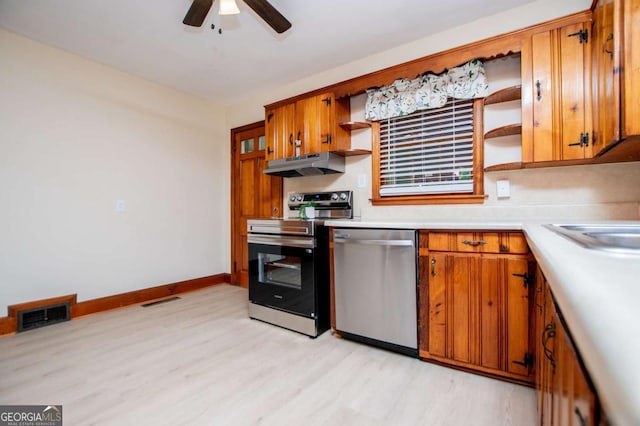 508 College St, Bowdon, GA 30108 - kitchen with appliances with stainless steel finishes, open shelves, under cabinet range hood, light wood-style flooring, and a ceiling fan