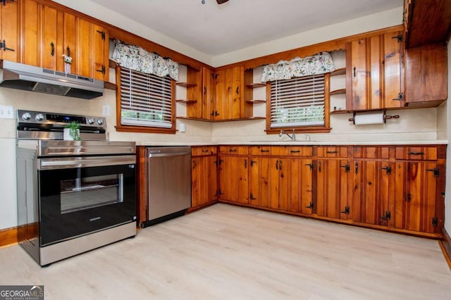 508 College St, Bowdon, GA 30108 - kitchen with stainless steel appliances, open shelves, under cabinet range hood, light wood-style flooring, and light countertops