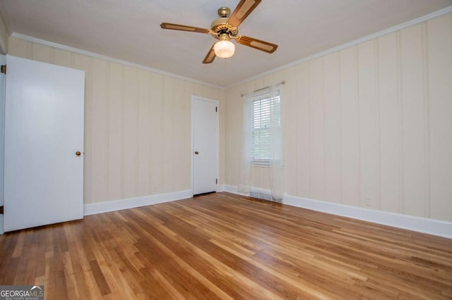 508 College St, Bowdon, GA 30108 - unfurnished room featuring crown molding, wood finished floors, and a ceiling fan