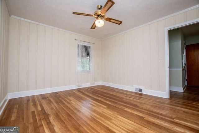 508 College St, Bowdon, GA 30108 - spare room featuring ornamental molding, hardwood / wood-style flooring, and ceiling fan